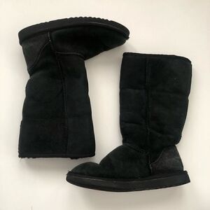 Ugg’s classic tall boots in black shearling lined